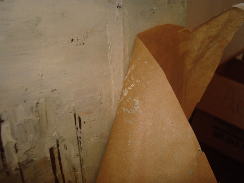 Handling and transportation. wrapping paper attached to the surface of the painting..