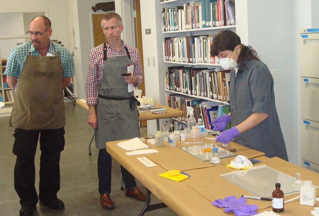 Grinding pigments during the workshop